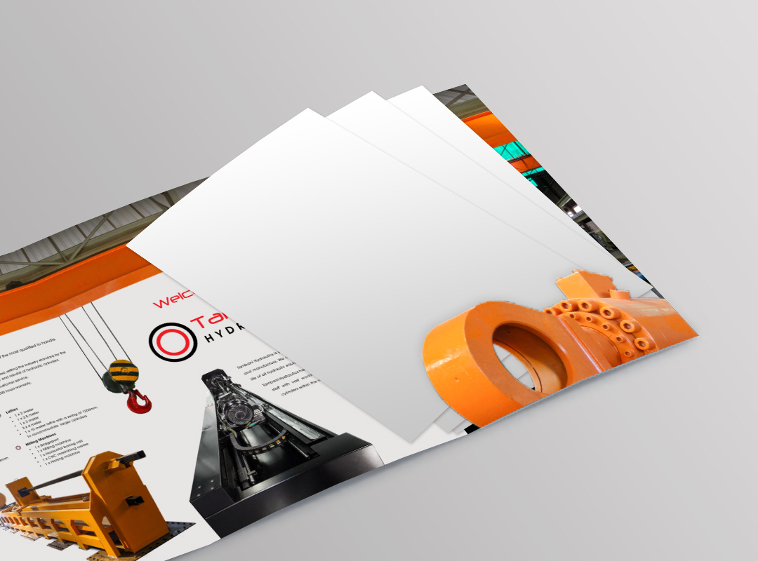 Tambani Hydraulics collateral mockup showing industrial brochure pages with machinery imagery, technical information and orange, red and black graphic elements.