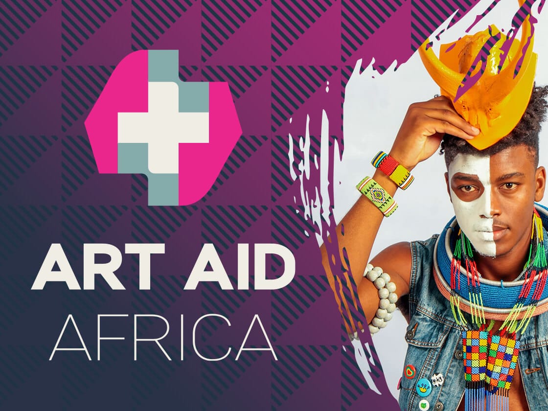 A young man wearing colorful beads, bracelets, face paint, and a bright yellow hat poses artistically. On the left, a pink and gray geometric logo with a white cross appears above the bold text "ART AID AFRICA" on a purple patterned background.