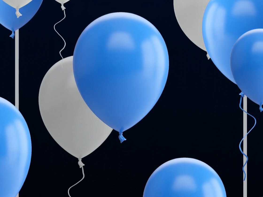 A cluster of blue and white balloons against a dark background sets the perfect scene for a birthday party. Shiny and reflecting light, these balloons hang from thin strings, creating a festive atmosphere. Their varying sizes and partial overlaps add to the lively video capturing this joyous occasion.