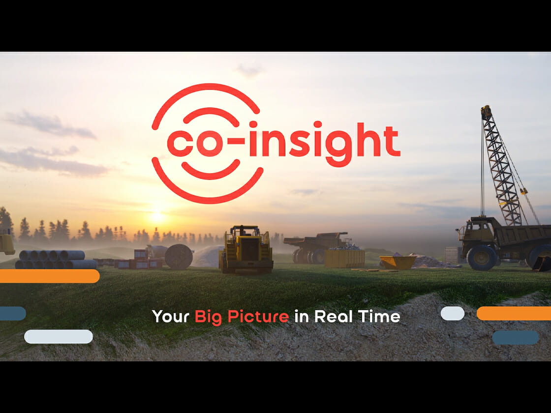 Construction site at sunrise with a crane and heavy machinery, featuring the video of the logo animation and slogan 'co-insight: your big picture in real time'.