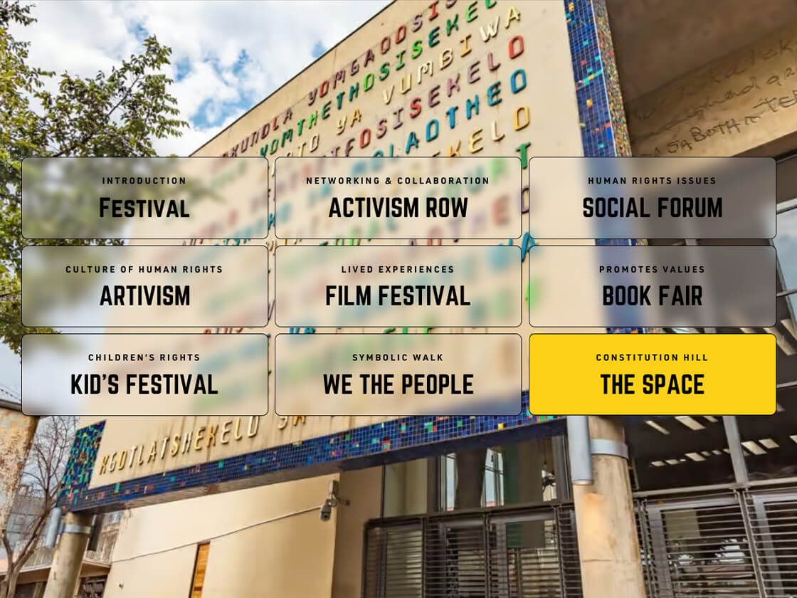 A colorful display of signs for different social and cultural events, including the Human Rights Festival, at a venue named "Conhill" at Constitution Hill.