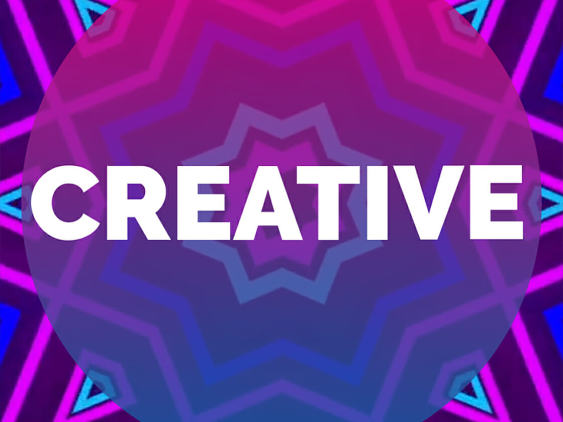 Abstract kaleidoscopic background with the word "creative" in bold white letters, perfect for 2022 upbeat video content.