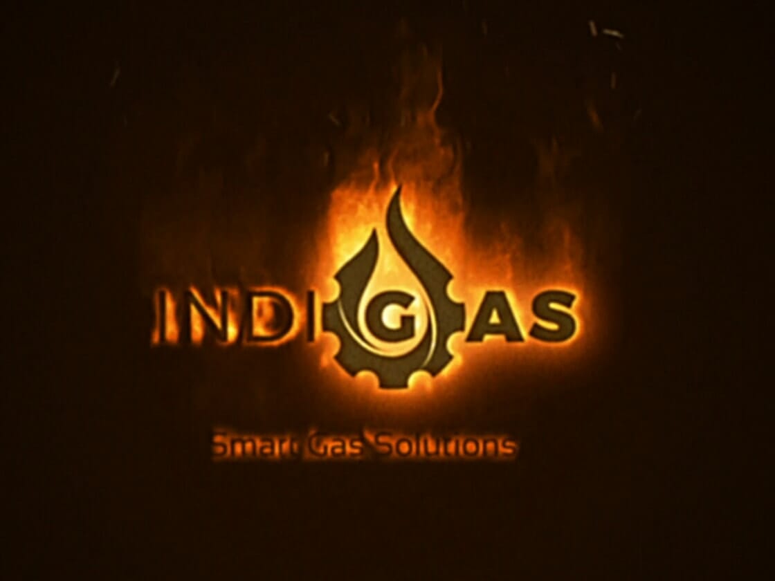 A logo featuring the text "INDI GAS" with the "I" in "INDI" stylized as a drop of gas inside a gear symbol, all set against a background of flames. Below the main text, the tagline "Smart Gas Solutions" is displayed in smaller font. The overall color theme is fiery orange and black.