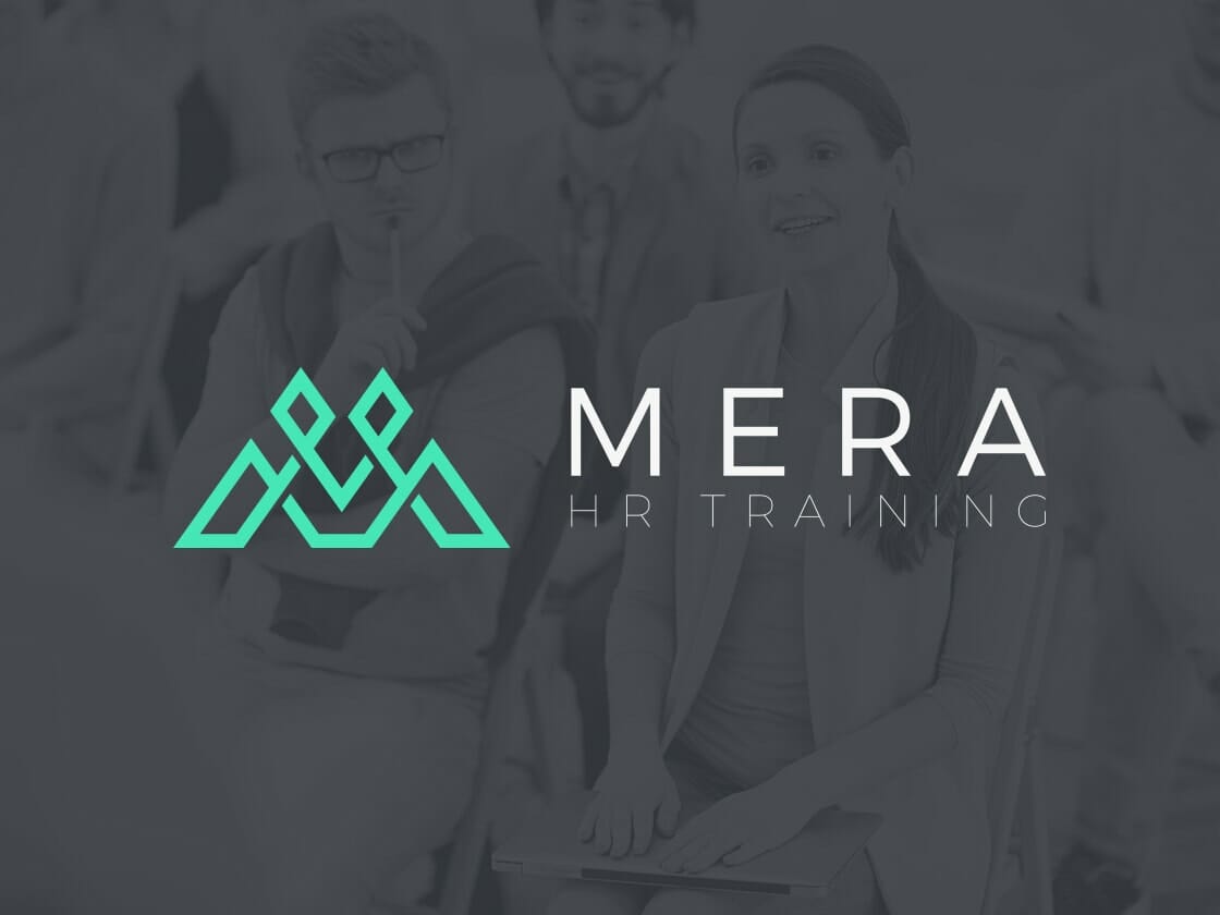 A professional setting where people are seated and listening attentively. The focus is on a logo with an abstract design beside the text "MERA HR TRAINING." The background is grayscale, while the logo and text are in a teal color, making them stand out.