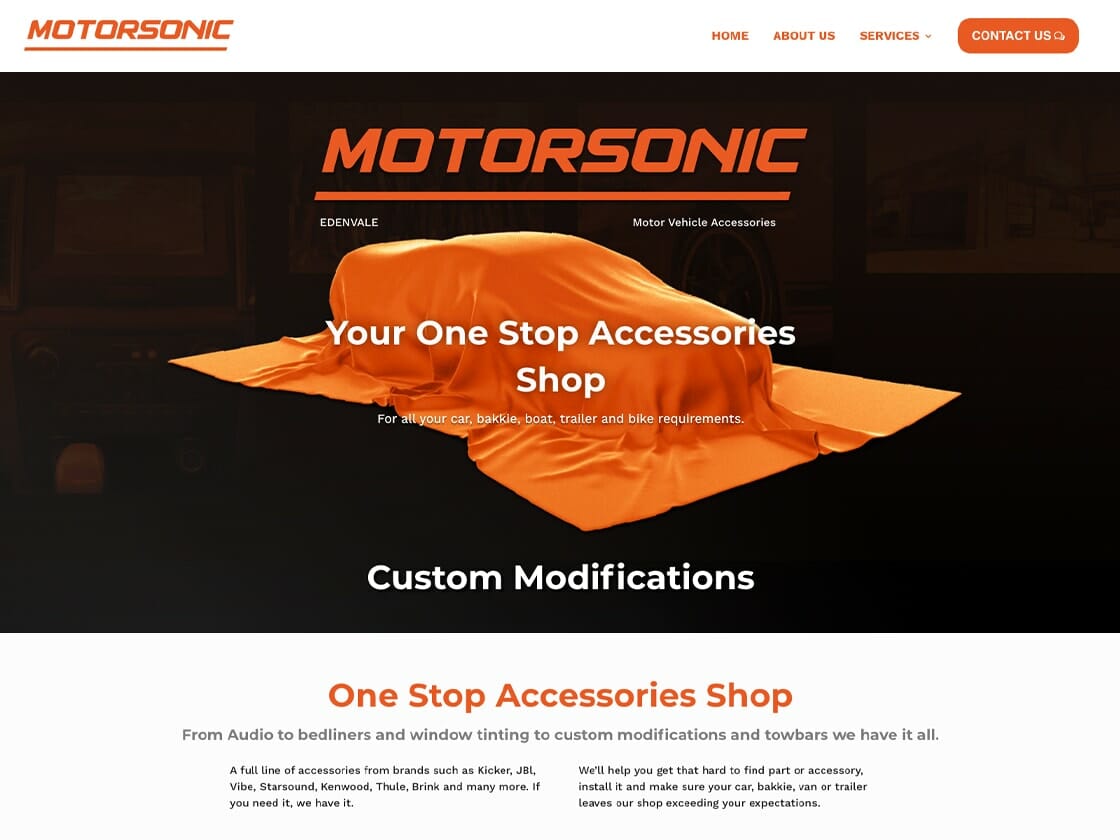 A covered vehicle on the Motorsonic website page advertising custom modifications and accessories for cars, bikes, and trailers.