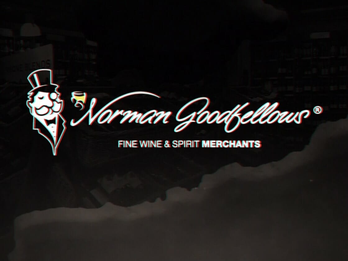 An enticing image showcases the "Norman Goodfellows" logo against a dark background, featuring a man in a top hat and monocle holding a small glass. Below, the text reads, "FINE WINE & SPIRIT MERCHANTS." A subtle Black Friday teaser hints at upcoming exclusive deals.