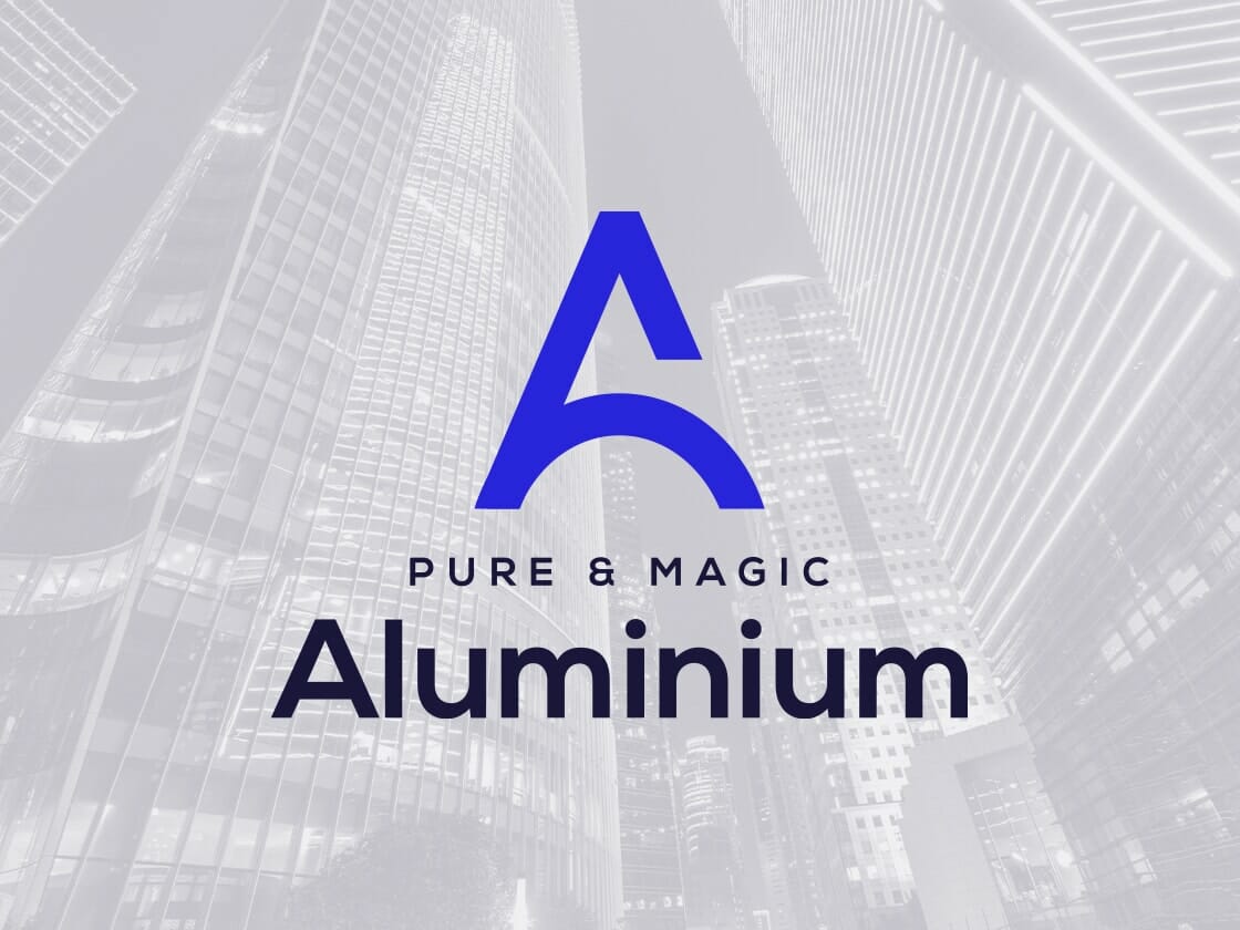 A large blue stylized letter "A" appears prominently in the center of the image. Below it, the text reads "PURE & MAGIC Aluminium" in uppercase and title case respectively. The background features a monochromatic cityscape with tall, modern skyscrapers.