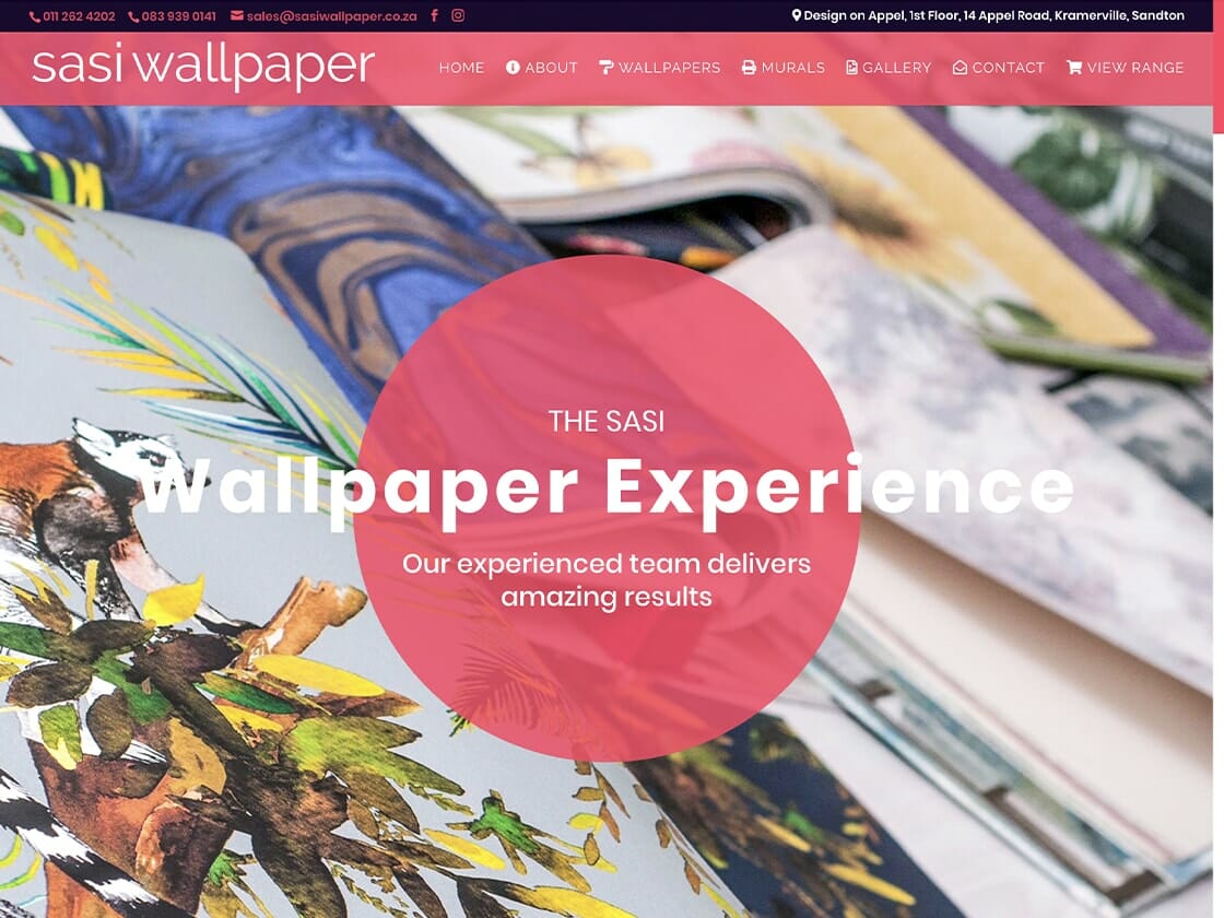 Screenshot of the Sasi Wallpaper website. The homepage showcases a banner image of colorful, tropical-themed wallpaper samples. A pink circle in the center reads: "THE SASI Wallpaper Experience. Our experienced team delivers amazing results." The top menu features options like "Home," "About," and more.