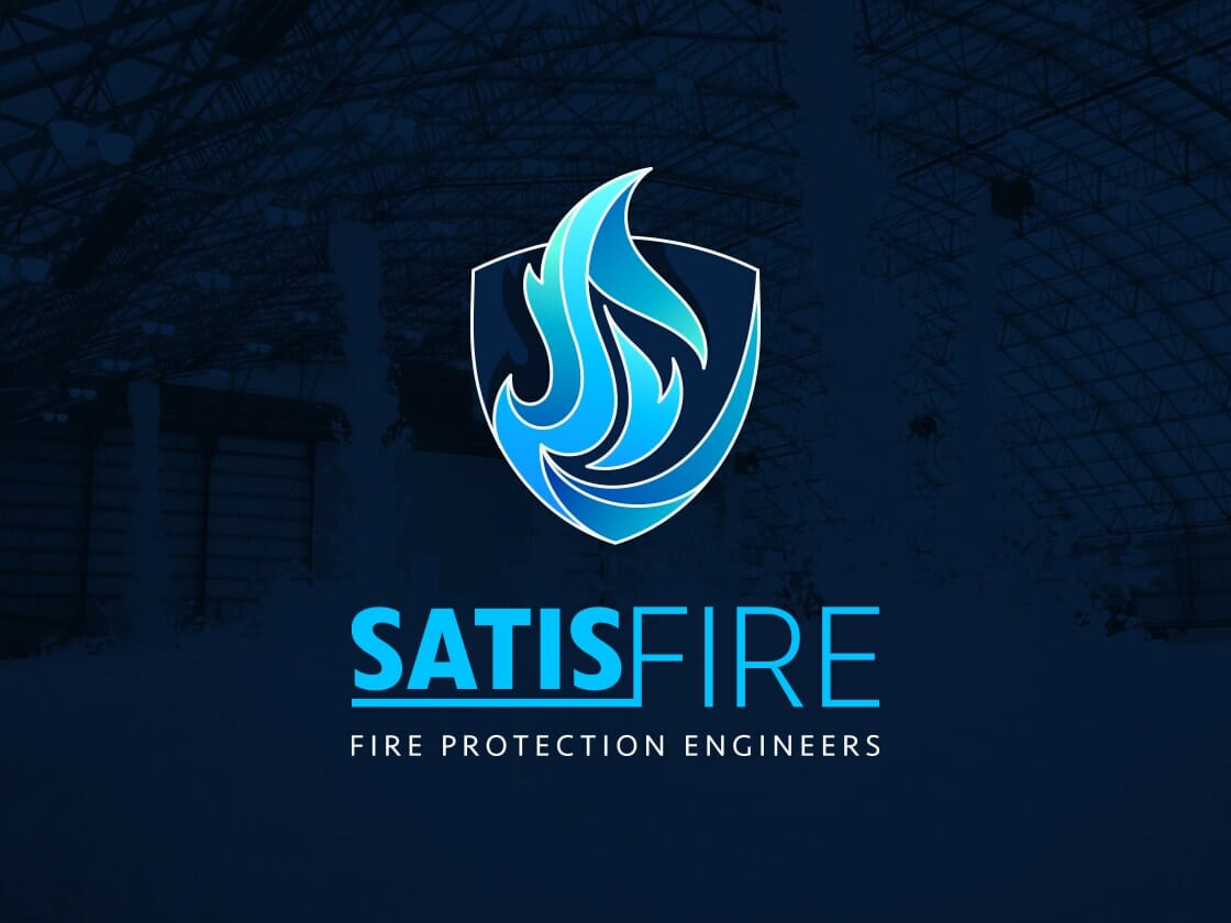 A logo for SATISFIRE set against a dark background of an industrial interior. The logo features a blue, stylized flame enclosed within a dark shield shape, symbolizing security and protection. "SATISFIRE" is in bold, blue text with the tagline "FIRE PROTECTION ENGINEERS" beneath it.