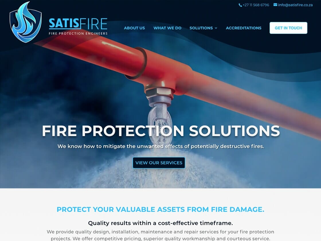 A screenshot of the Satisfire fire protection company's website homepage featuring a banner with the text "fire protection solutions" and a call-to-action button labeled "view our services.