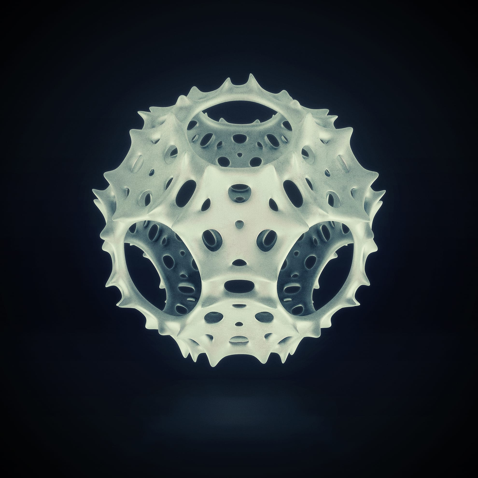A 3D geometric shape appears suspended against a dark background. The object has a spherical form with a complex, perforated surface featuring numerous holes and spikes, giving it an organic, lattice-like appearance. The lighting highlights its intricate design.