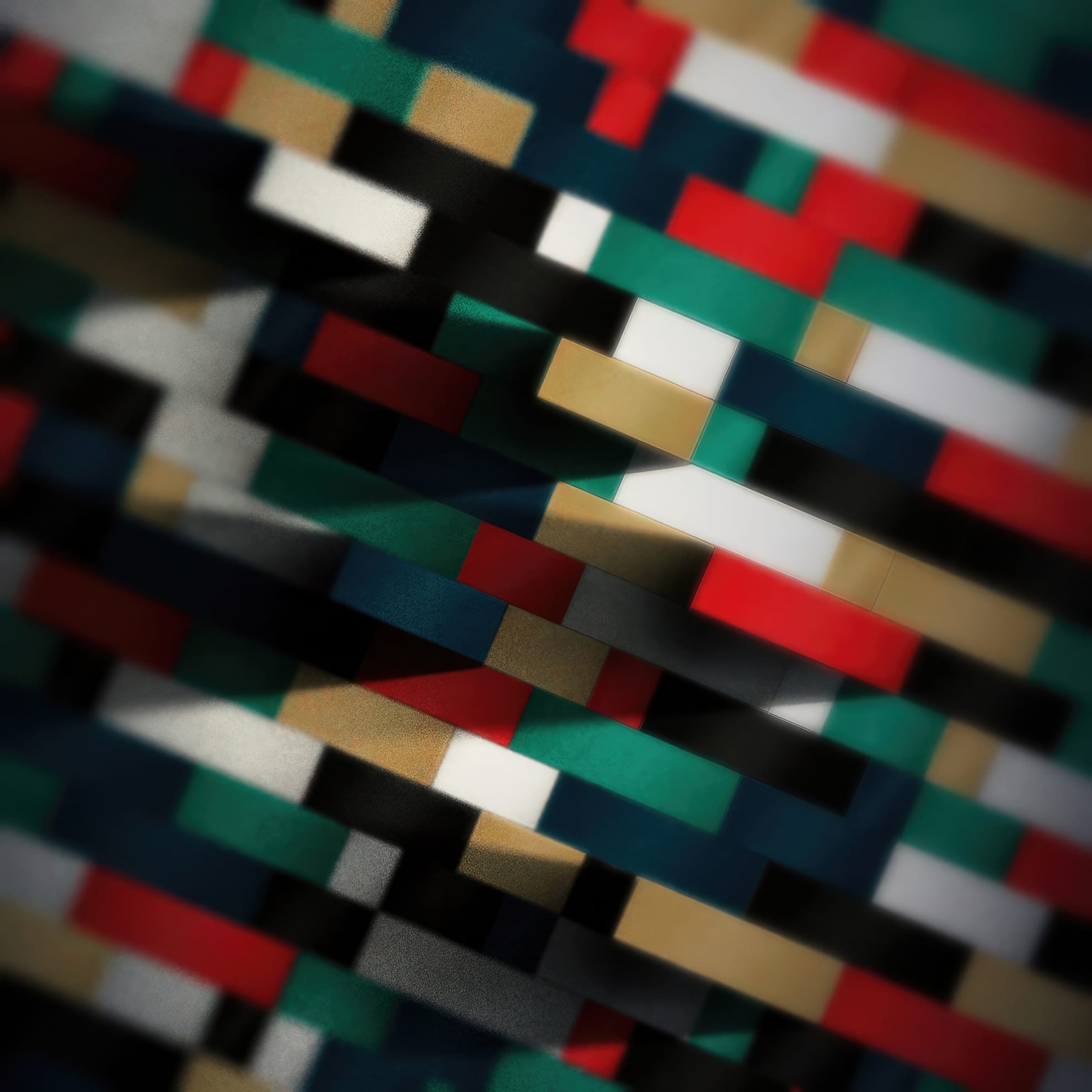 Abstract image featuring a retro pattern of interlocking, multicolored rectangular blocks in red, green, blue, white, black, and beige. The blocks create a layered, three-dimensional effect with varying light and shadow, producing a sense of depth and texture throughout the composition.